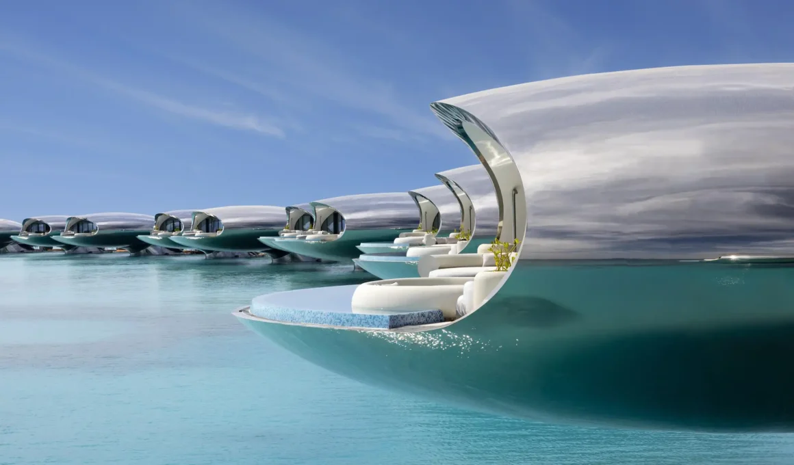 Killa Design's stainless steel Shebara Resort villa cantilevered over Red Sea at sunset | Sheybarah Island eco-luxury | Solar powered reflective architecture