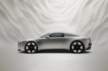 Audi Concept C all-electric roadster in titanium finish, showcasing new vertical frame grille and radical simplicity design philosophy on a dynamic turntable.
