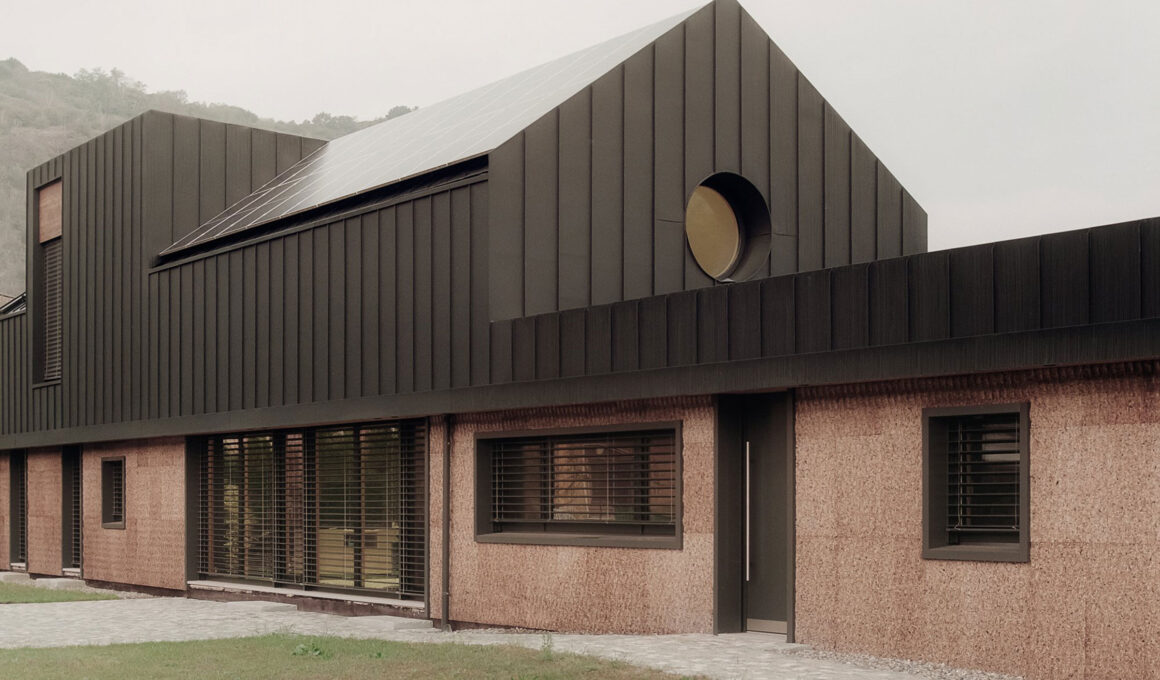 Cork cladding facade on the House on the Border by LCA Architetti, showcasing textured sustainable building materials and modern bioophilic design.