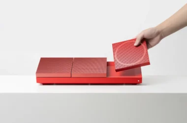 Hotcake modular magnetic speaker system showing wearable wrist strap and wireless daisy-chaining for collaborative music play.