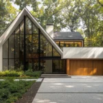 Modern home with excellent kerbside appeal featuring a blue front door, potted plants, and a tidy landscaped garden
