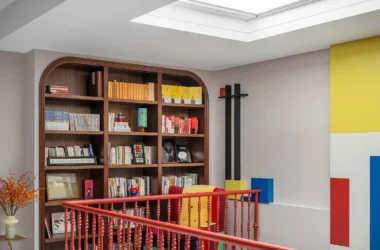 Mondrian-inspired living room with red spiral staircase and built-in library | Beijing home design by Xia Fu, Shangceng Design