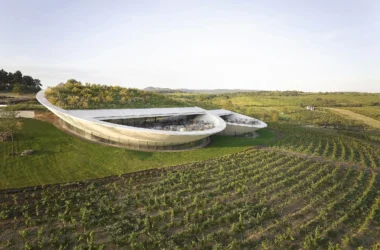 Aerial view of the contemporary Sauska Tokaj winery by BORD Architectural Studio, a floating concrete and glass structure with sunset terraces overlooking the vineyards of the UNESCO Tokaj wine region, Hungary.