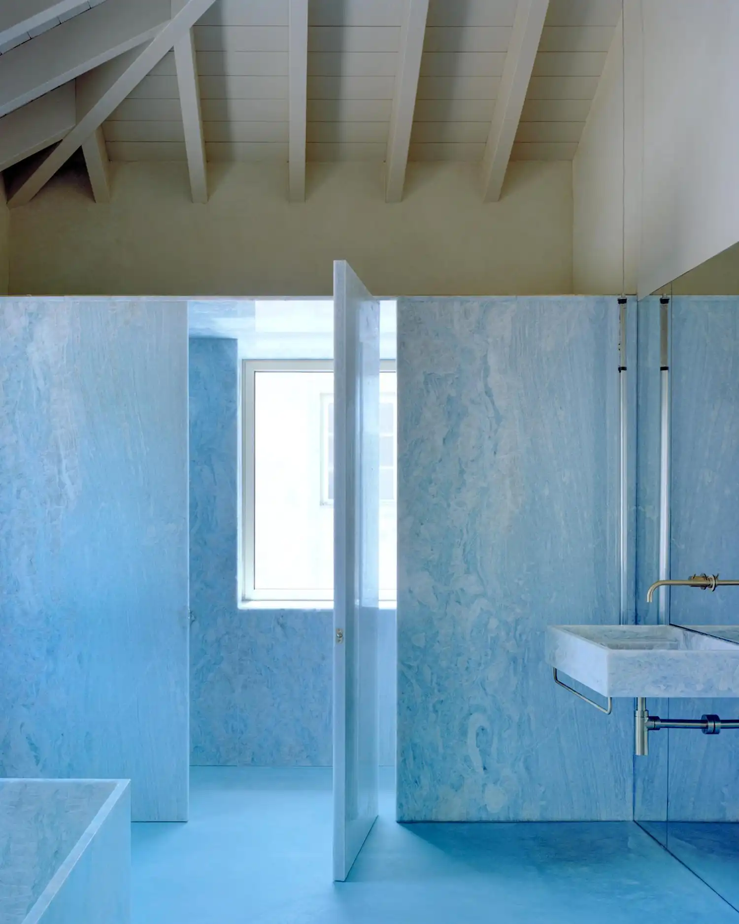 Arquitectura-G Transforms Sintra Wine Cellar into Contemporary Dwelling Cast in Blue Light