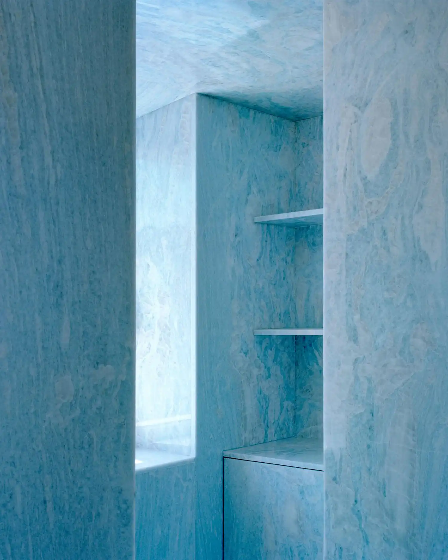 Arquitectura-G Transforms Sintra Wine Cellar into Contemporary Dwelling Cast in Blue Light