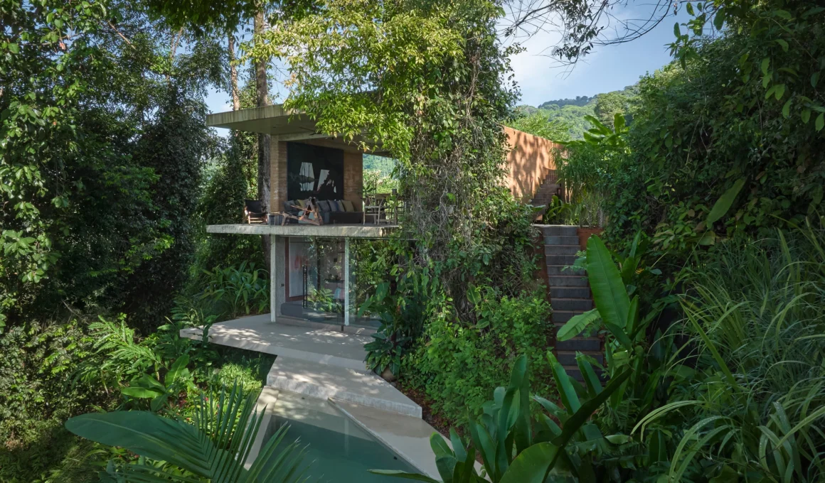 Formafatal Studio House Costa Rica rammed earth and Cor-ten steel jungle villa exterior ocean sunset view