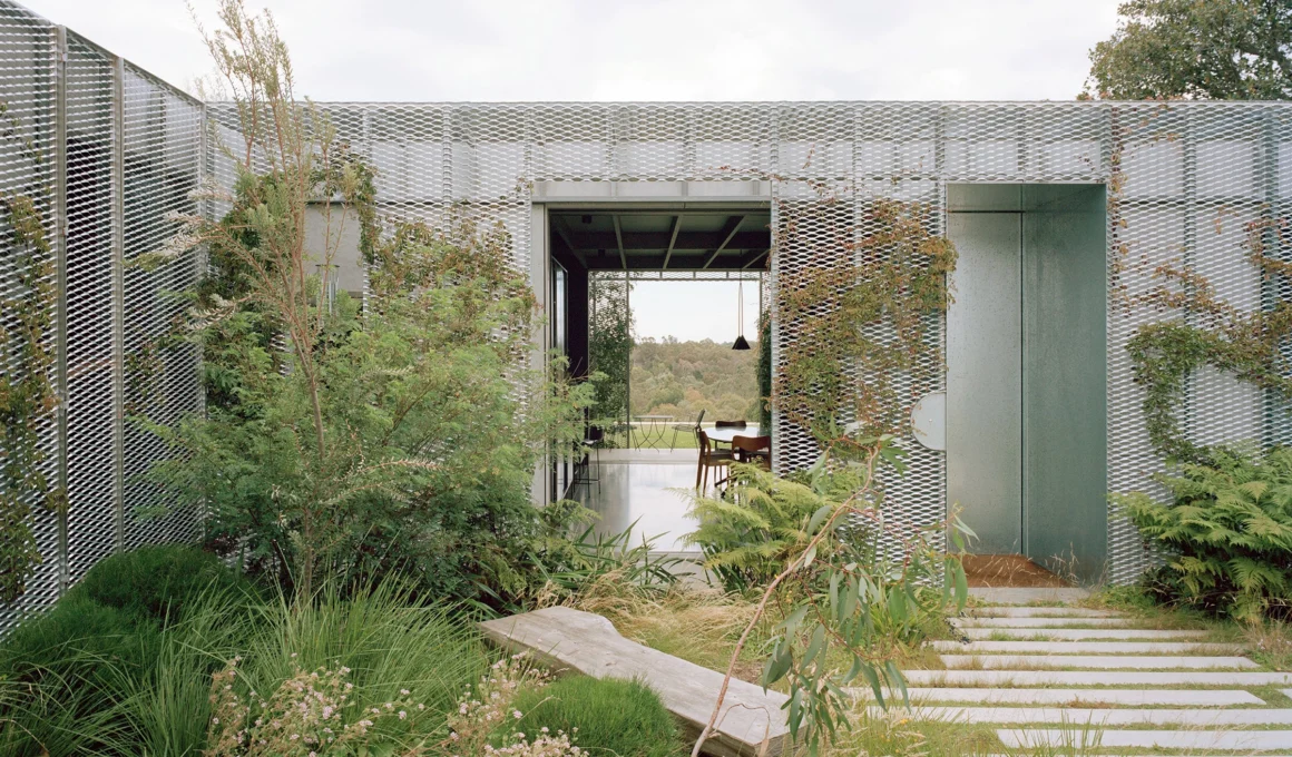 Hedge and Arbour House exterior by Studio Bright showing garden wall and vine-covered arbour in Melbourne