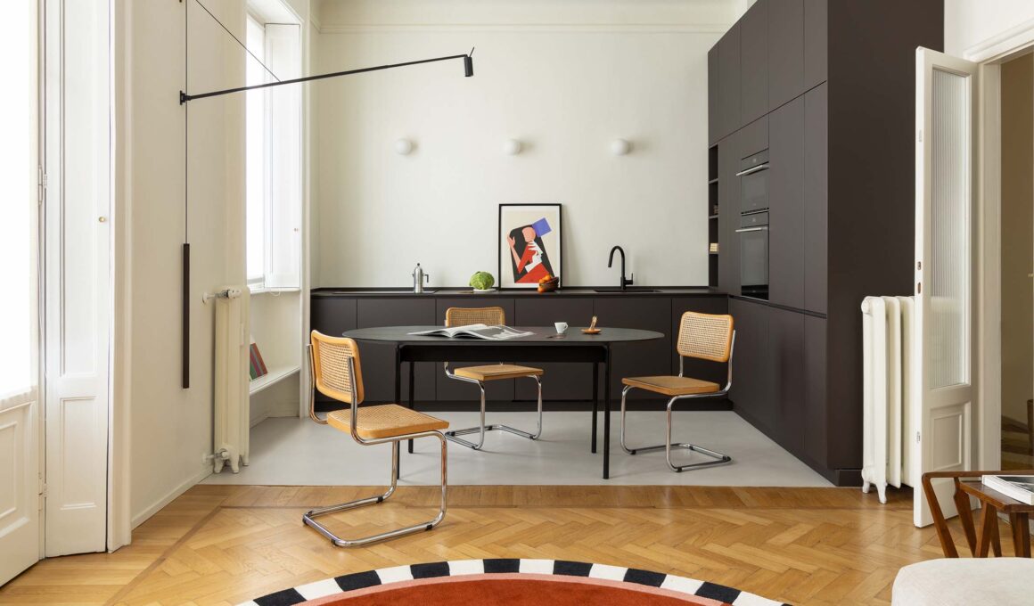 Pale Apartment Milan kitchen Atelierzero renovation modern gray resin flooring against 20th-century parquet
