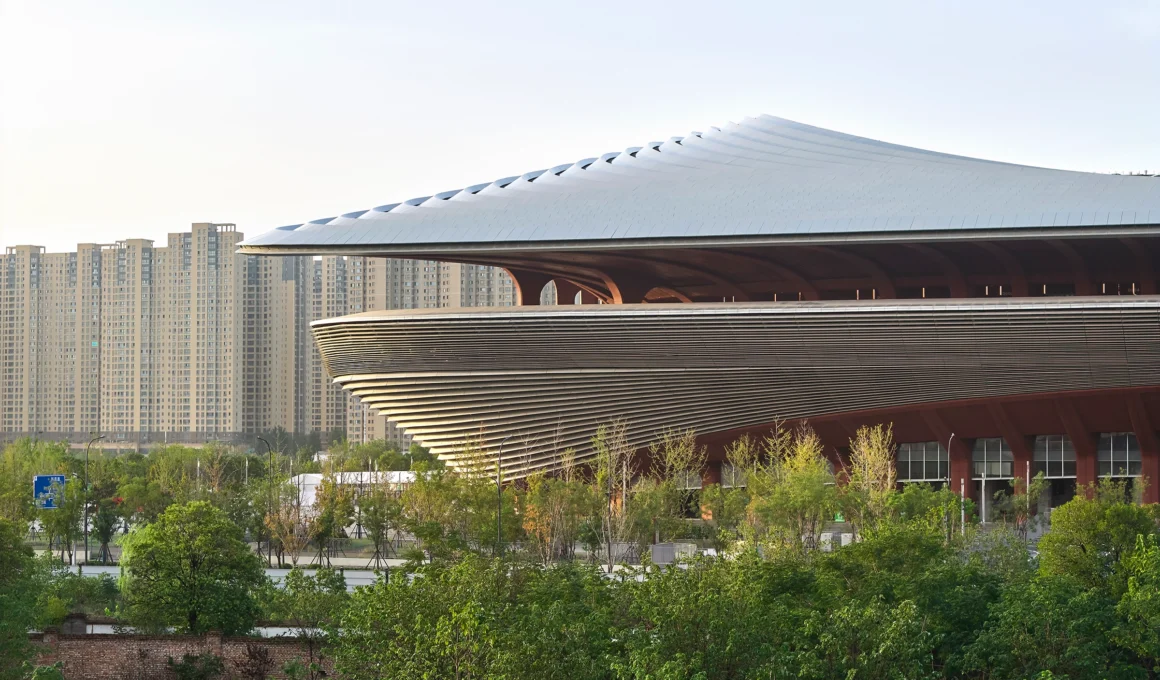 Zaha Hadid Architects Xi'an International Football Centre aerial view fluid geometry cable net roof 60000 seat stadium China sustainable design architecture