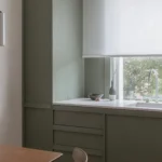 Architecture for London Highbury Flat bespoke kitchen refurbishment with green ash veneer cabinets and Caesarstone Misty Carrera worktops in Islington N5.