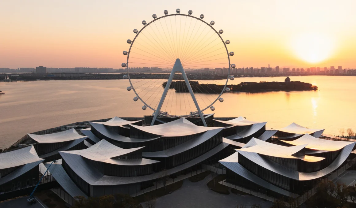 BIG Bjarke Ingels Group Suzhou MoCA museum aerial view, undulating roof architecture on Jinji Lake waterfront