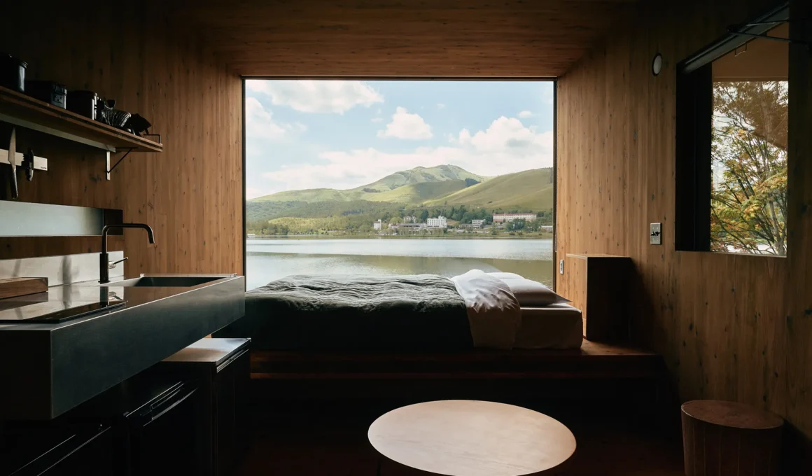 PAN-PROJECTS Earthboat Cave CLT cedar cabin exterior view in Shirakabako Nagano Japan forest overlooking lake