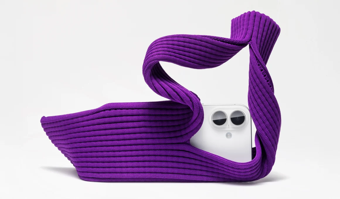 ISSEY MIYAKE Apple iPhone Pocket in Purple, showing the 3D-knitted wearable accessory and unique design.