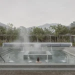 Pérez Gómez Arquitectura minimalist Hot Springs Garden main pool in Jalisco, Mexico; features an inverted pyramid design and concrete edges for thermal bathing.