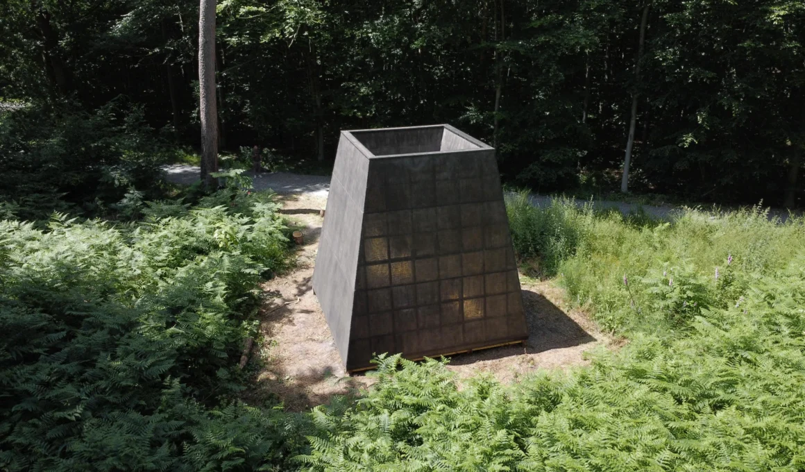 Compluvium Pavilion designed by P+S Estudio de Arquitectura in Forêt de Roumare, France, showing the geometric pinewood structure veiled by delicate linen and fibreglass skins.