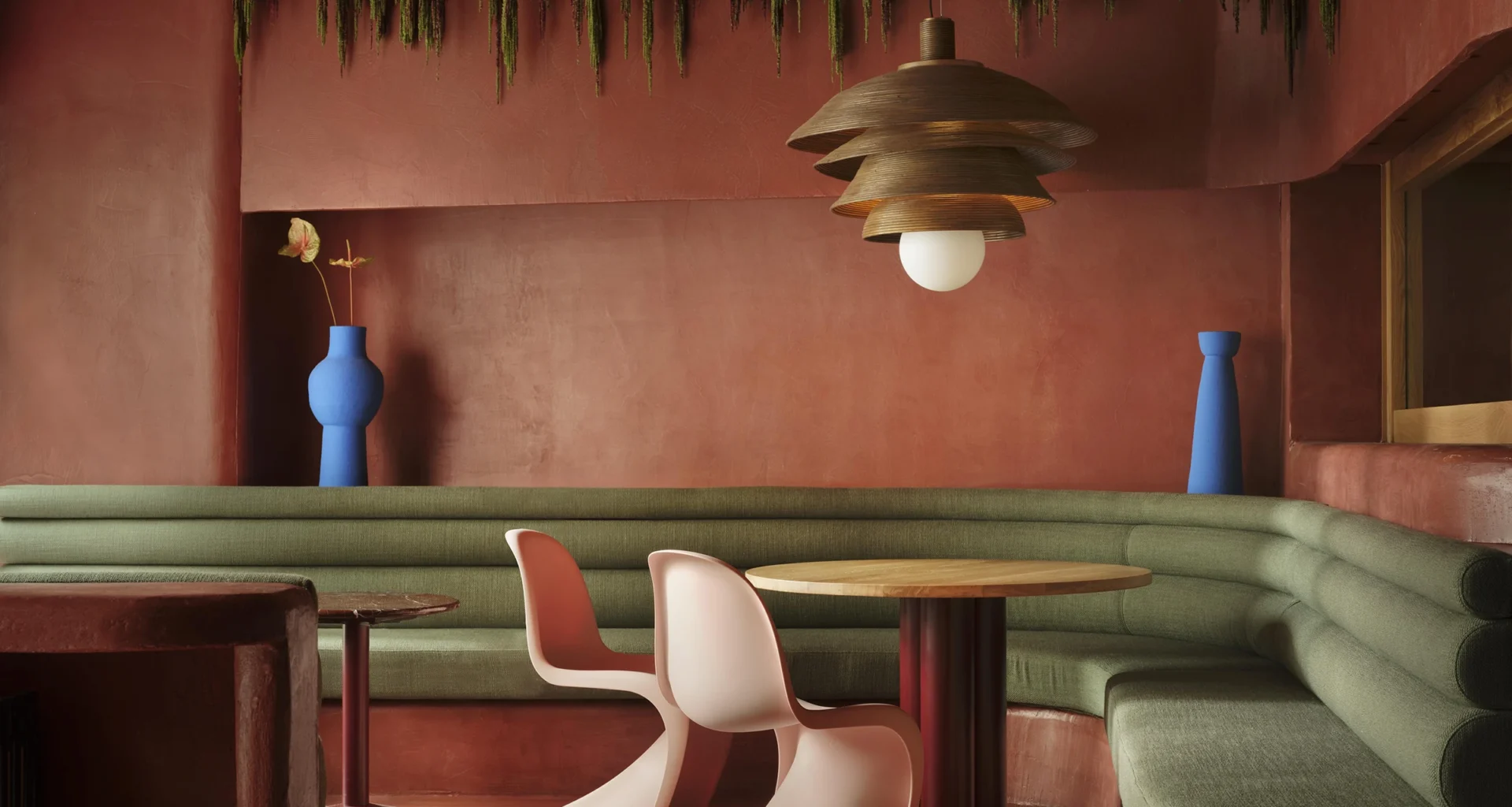 Pablo Roig Interior Design Superchulo Canalejas Madrid terracotta dining room curved wall Vitra chairs