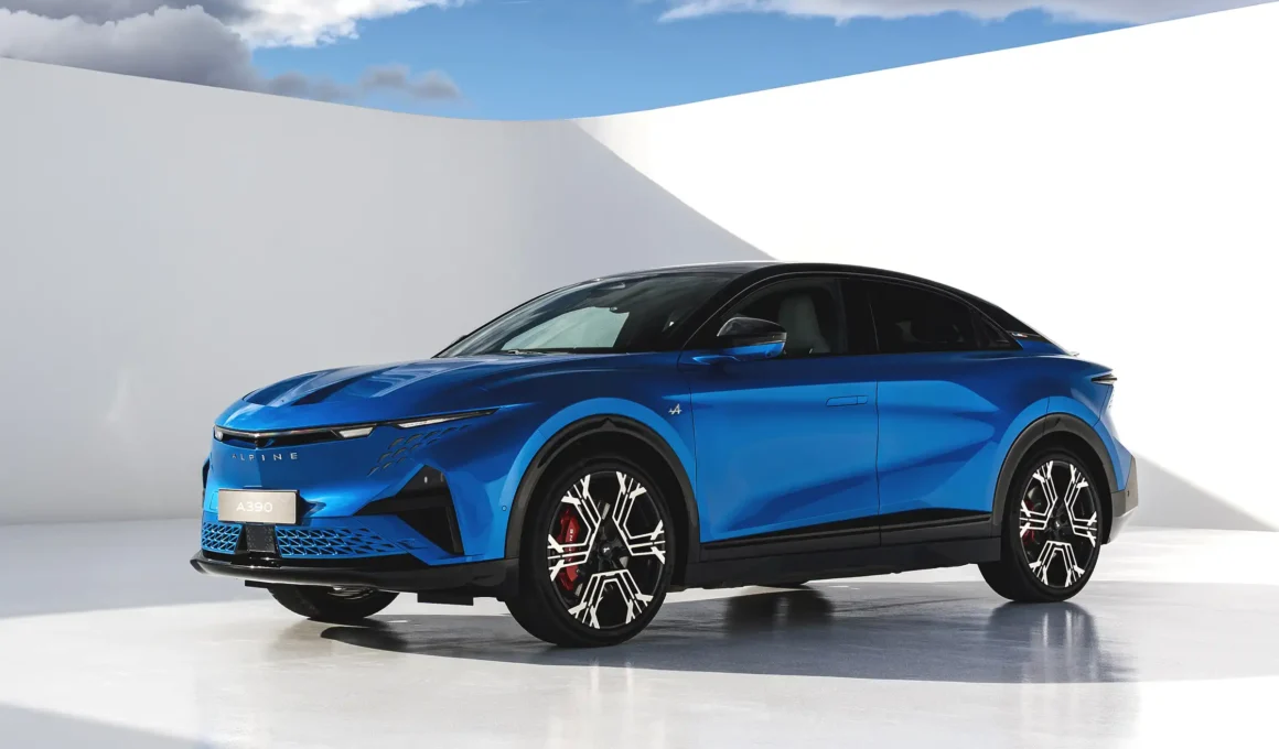 Alpine A390 Electric Sport Fastback 3/4 front view showing 'Cosmic Dust' LED signature and aerodynamic design.
