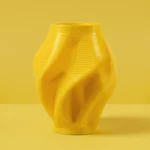 Yellow 3D printed geometric vase, master model for concrete fiberglass mold production.