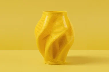 Yellow 3D printed geometric vase, master model for concrete fiberglass mold production.