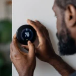 Man adjusting smart thermostat touch screen controlling high-efficiency HVAC for precision climate control in a modern, luxury living room.