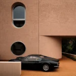 Locus Hobby House Pordenone facade: Curb view of cantilevered porch defining civic threshold architecture.