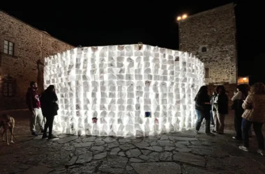 Luzinterruptus Art Collective's 'On Blank Pages' glowing circular notebook wall in Cáceres, Spain, launching the European Capital of Culture 2031 bid.