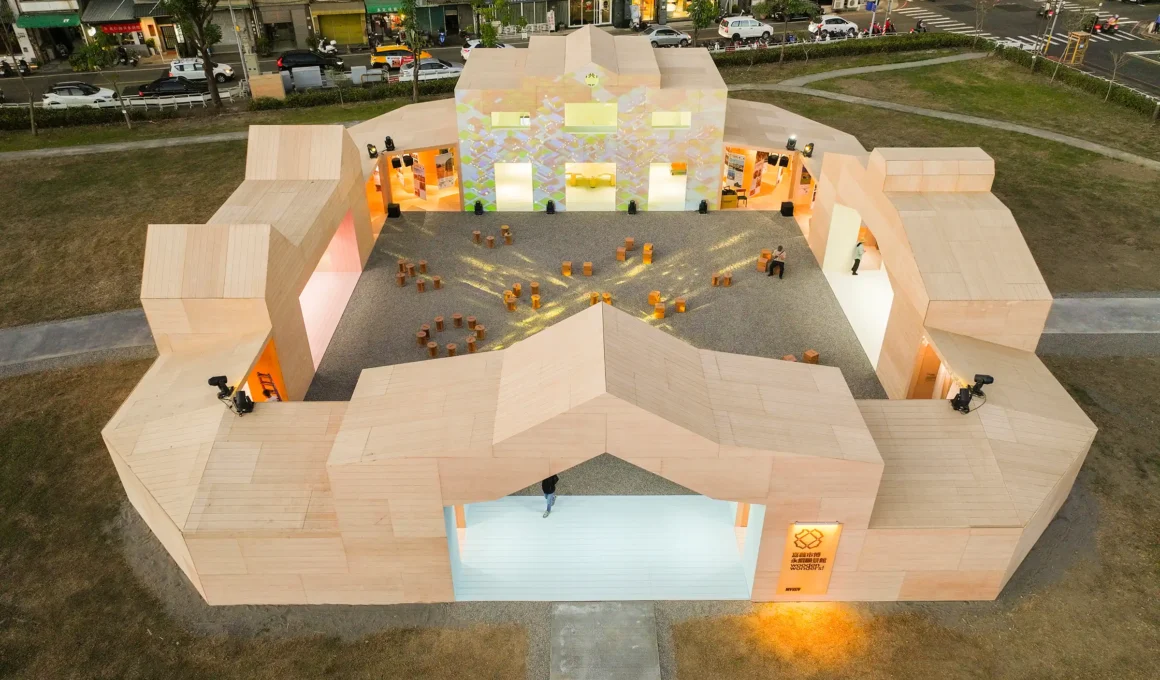 Aerial view of MVRDV's Wooden Wonders timber pavilion in Chiayi, featuring a central courtyard and geometric rooflines inspired by local cultural heritage.