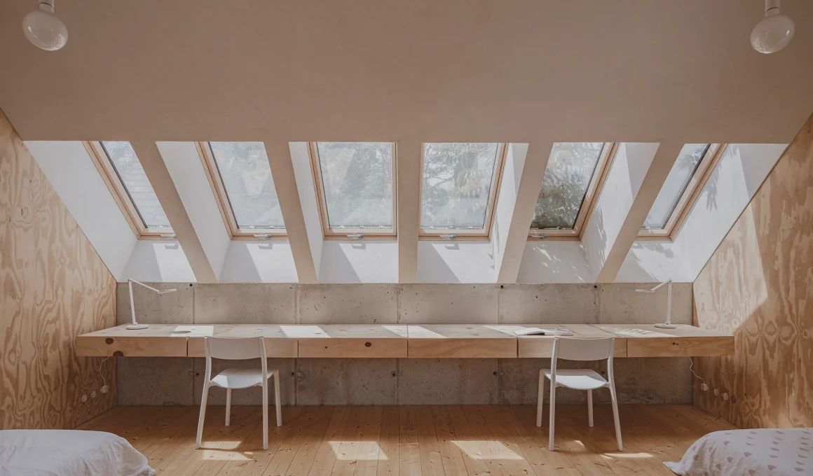 Sustainable hempcrete house kids room with skylights, custom pine desk, natural light, Szentendre Projectroom.