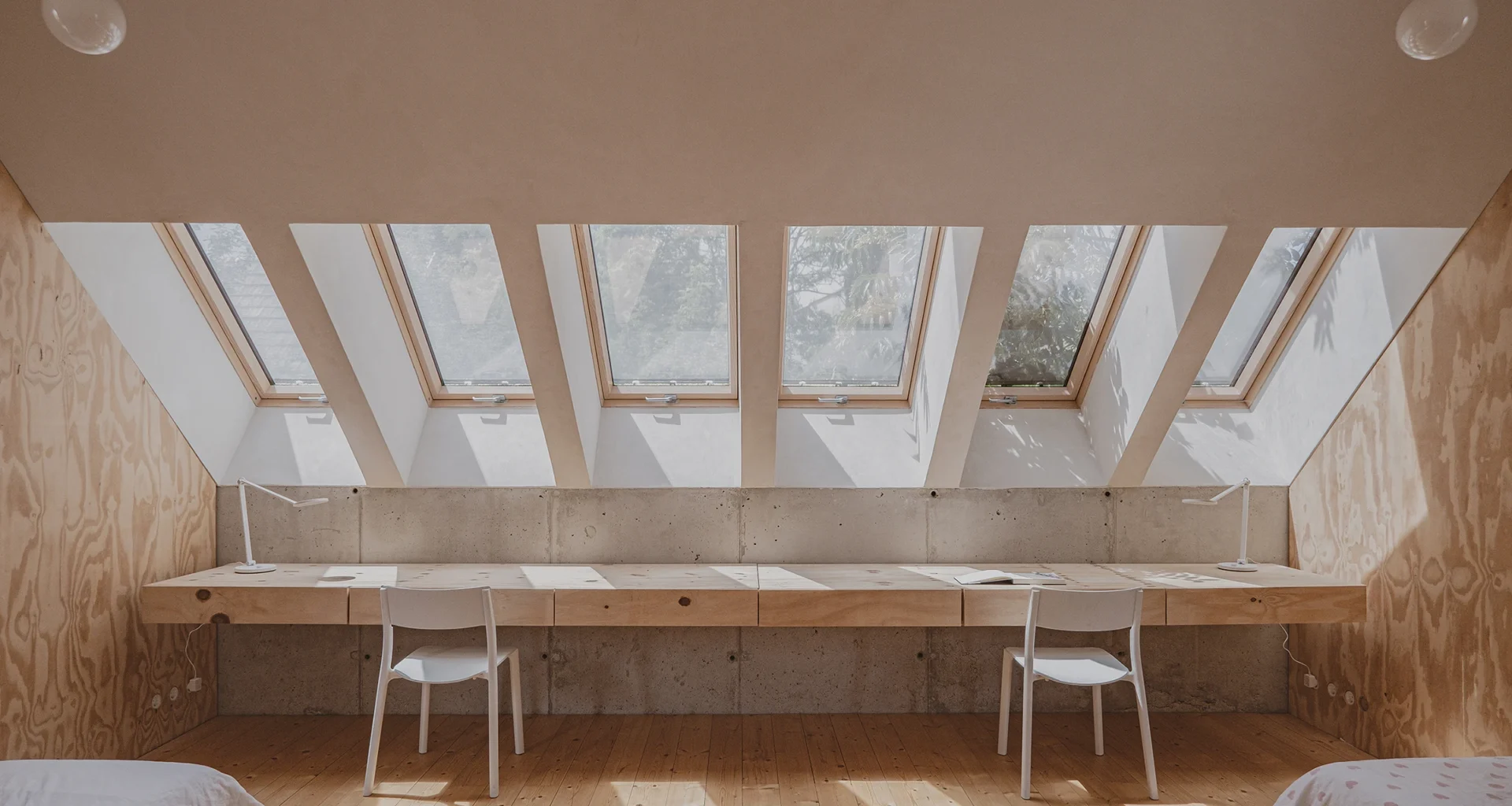 Sustainable hempcrete house kids room with skylights, custom pine desk, natural light, Szentendre Projectroom.