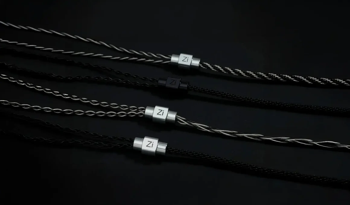 Three premium IEM cables by Zikman, showcasing black, silver, and clear braided 2-pin cable designs, reflecting European design culture and high-fidelity audio standards.