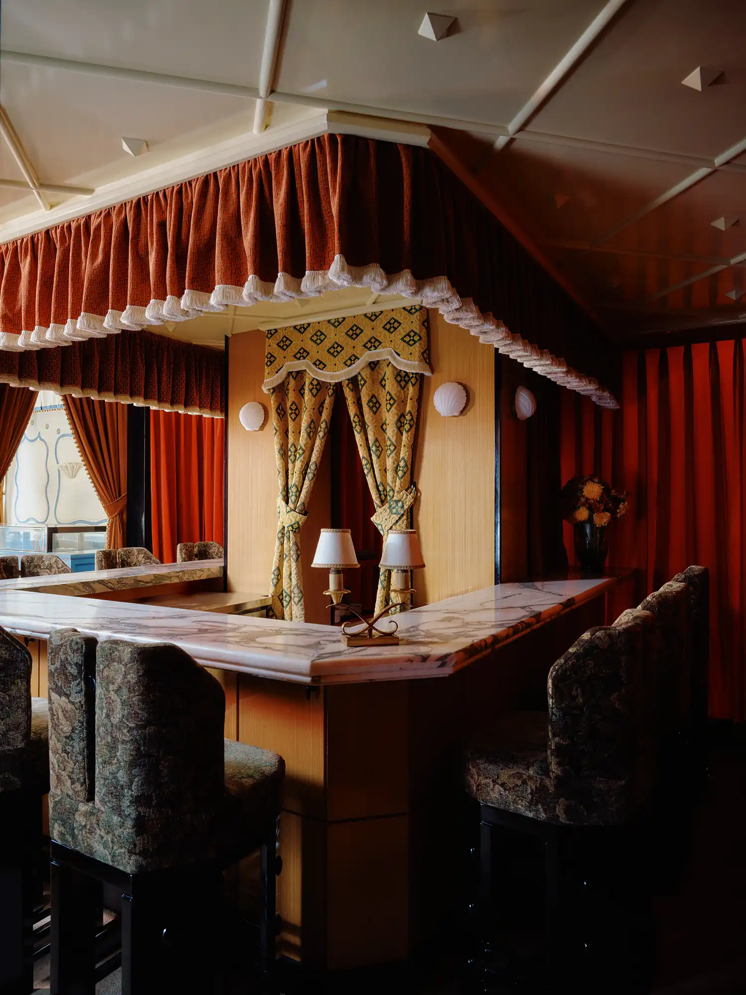 Ecru Studio Transforms 1970s Taipei Apartment Into a Patisserie With Velvet Reds and Ancient Motifs