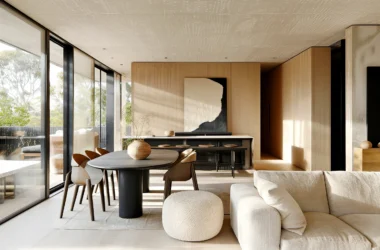 Minimalist Japandi living room featuring sustainable posters and wood-paneled walls by a panoramic window.