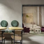 Luxury boutique hotel lobby at The Wheels Florence in Florence, showing the 14th-century coffered ceiling, eclectic design, and furnishings by Giacomo Totti.