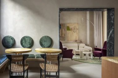Luxury boutique hotel lobby at The Wheels Florence in Florence, showing the 14th-century coffered ceiling, eclectic design, and furnishings by Giacomo Totti.