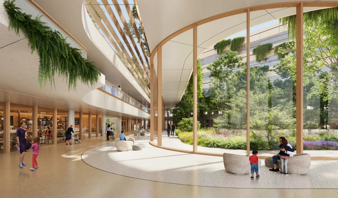 Zaha Hadid Architects Malpensa Hospital 'Main Street' atrium interior with curved wood finishes, natural light, and glass wall opening to biophilic healing courtyard garden in Milan, Italy.