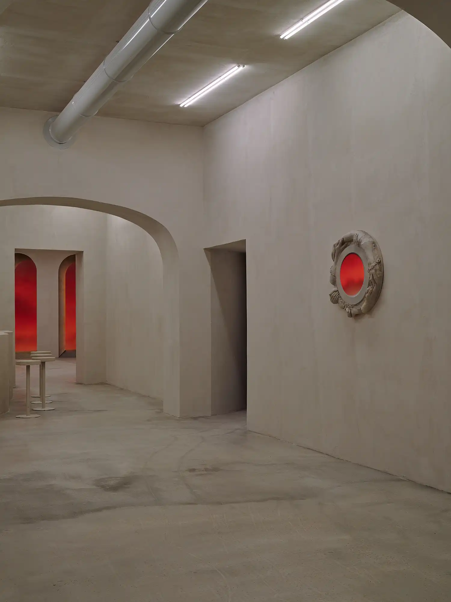Interior corridor of Bar Far with circular wall relief and glowing vista.