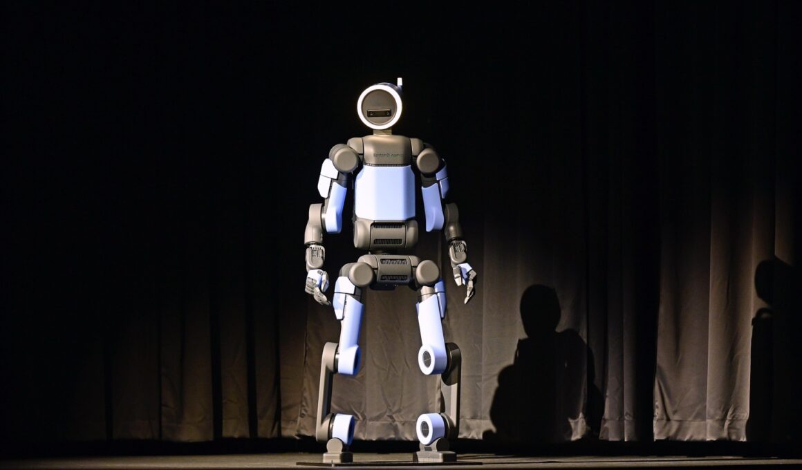 The fully electric Atlas robot stands center stage under a spotlight during its global debut at CES 2026 in Las Vegas.