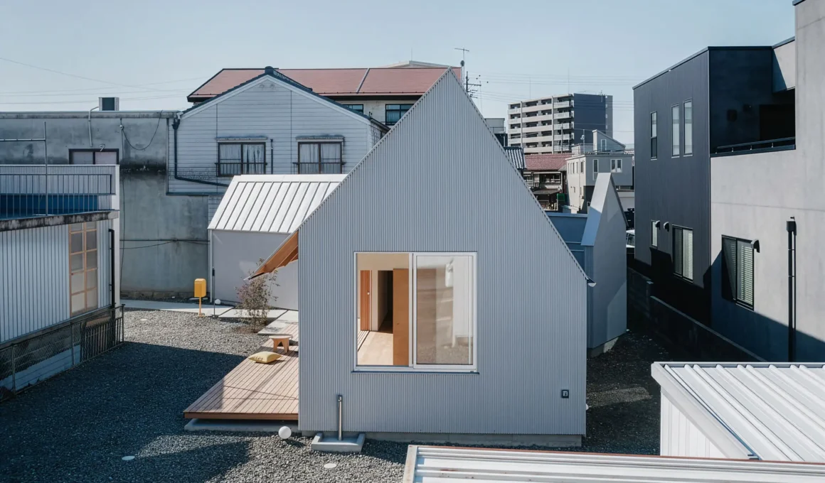 Exterior of Kaleidoscape House by Fumi Aso in Tajimi City showing corrugated metal siding and gabled roof profile.