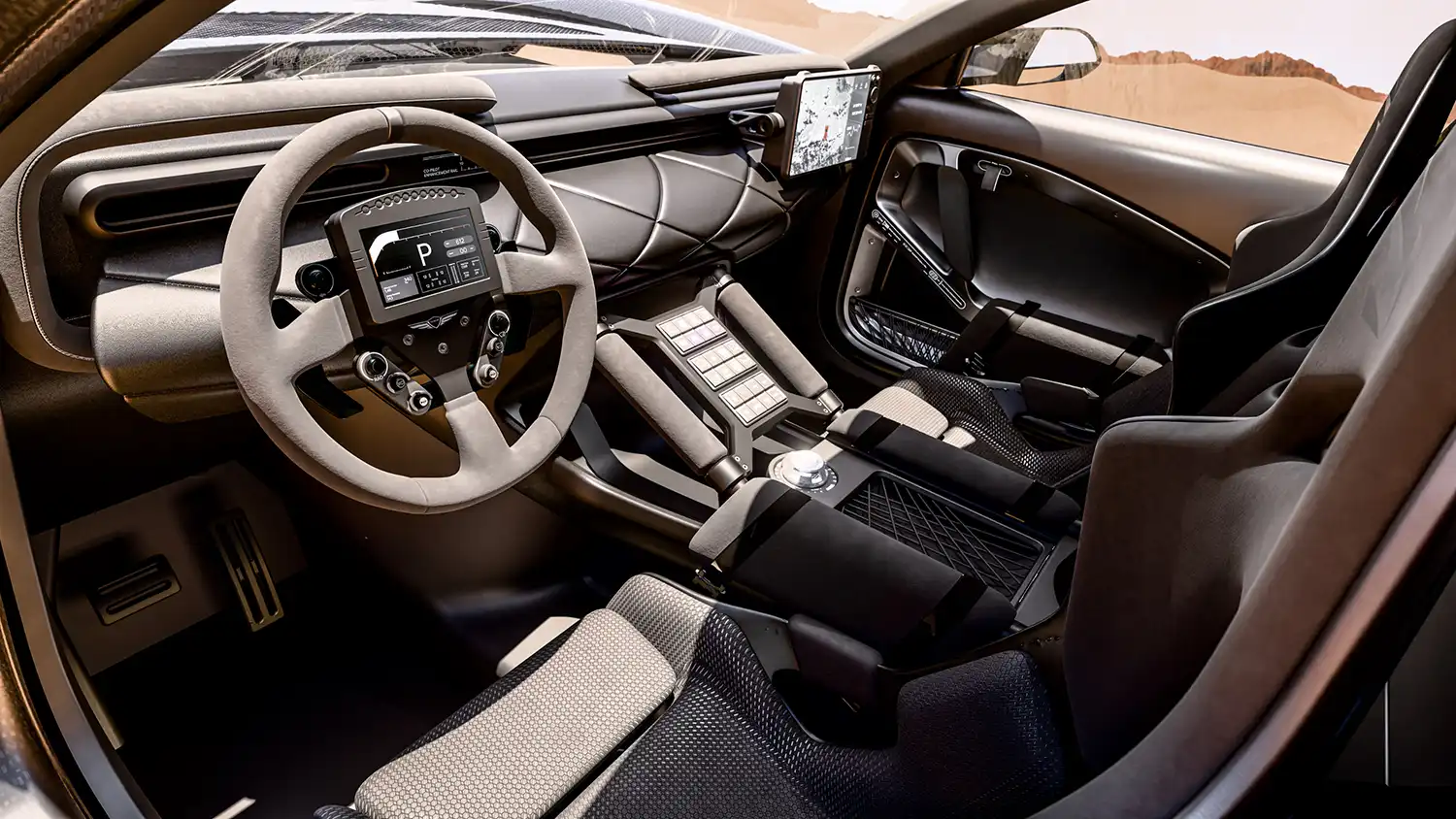 Interior cockpit of the Genesis X Skorpio with digital steering wheel display.