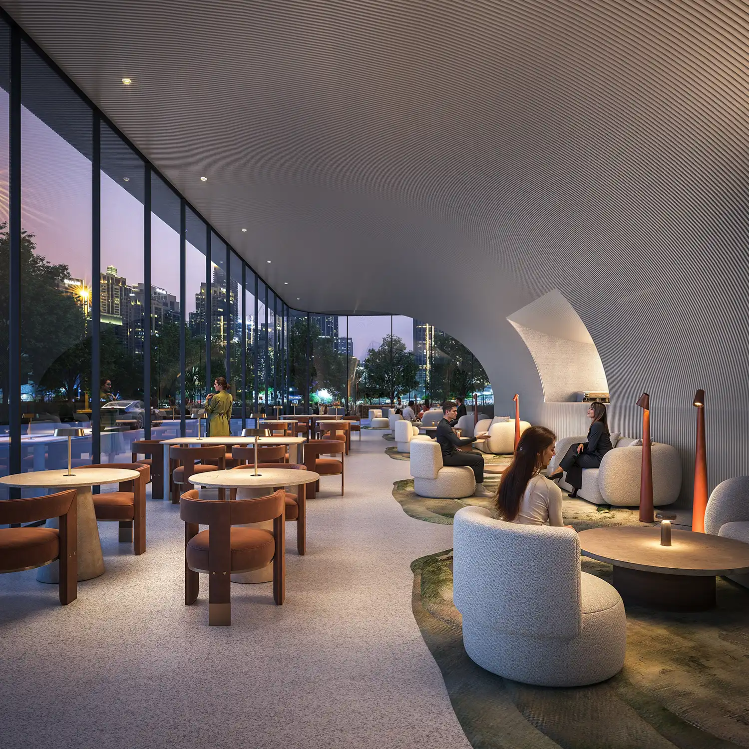 Contemporary interior design of Inaura’s ground-floor lobby with curved ceilings and designer furniture.