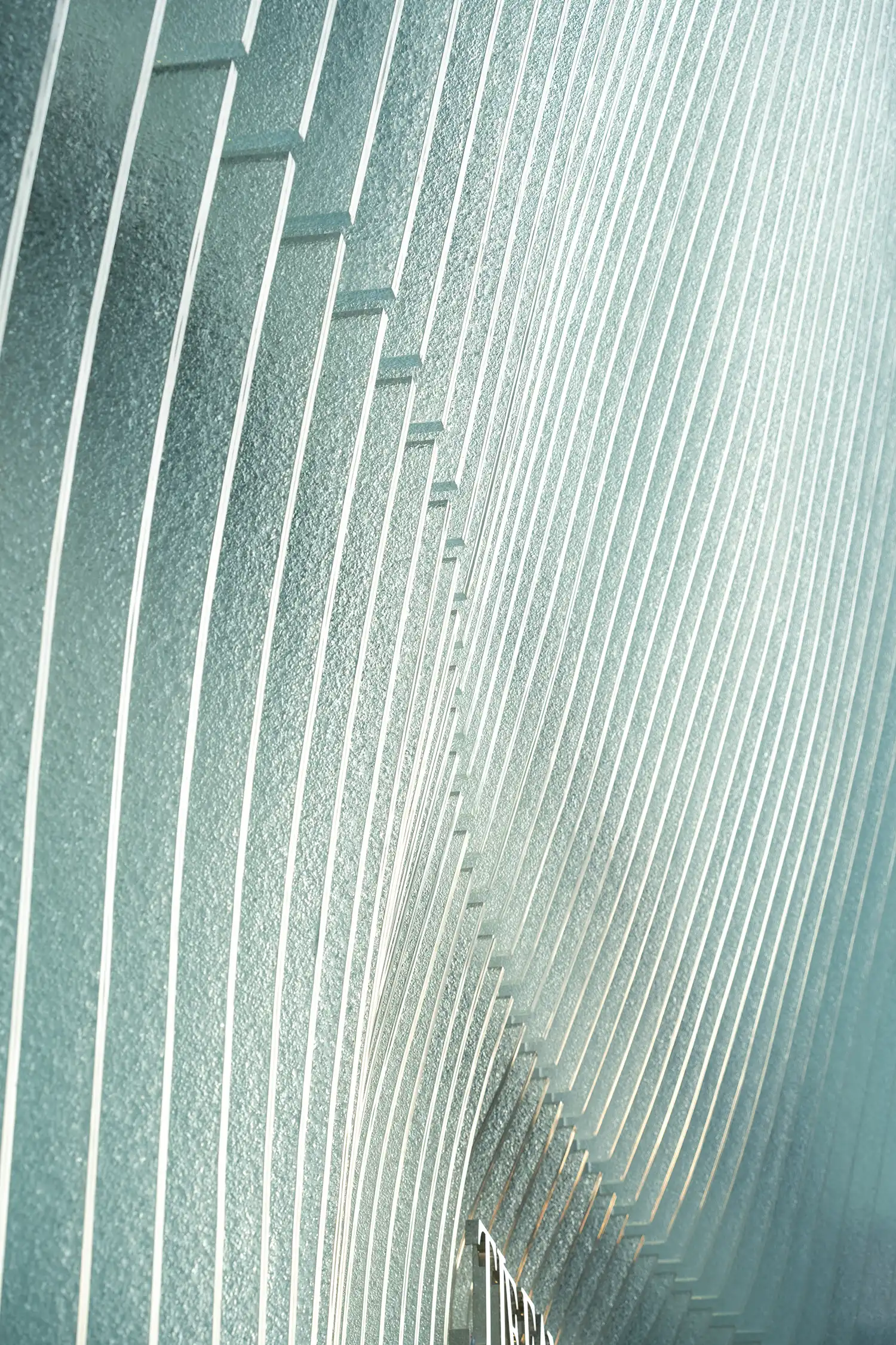 Detail of textured glass fins Tiffany Beijing flagship facade.