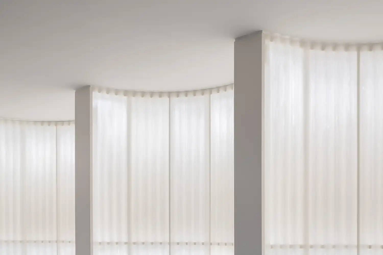 Close-up of the translucent, corrugated fiberglass wall with a soft, diffused light passing through the material.