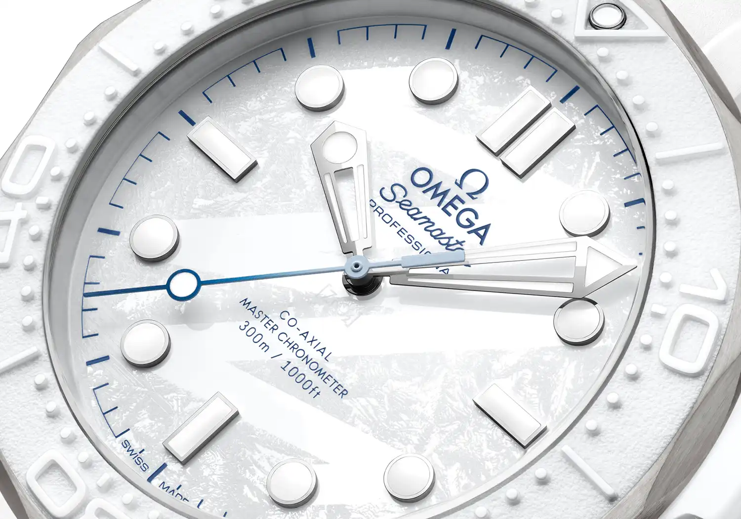 Macro shot of the white ceramic dial with "frosting" texture and blue-tipped seconds hand.
