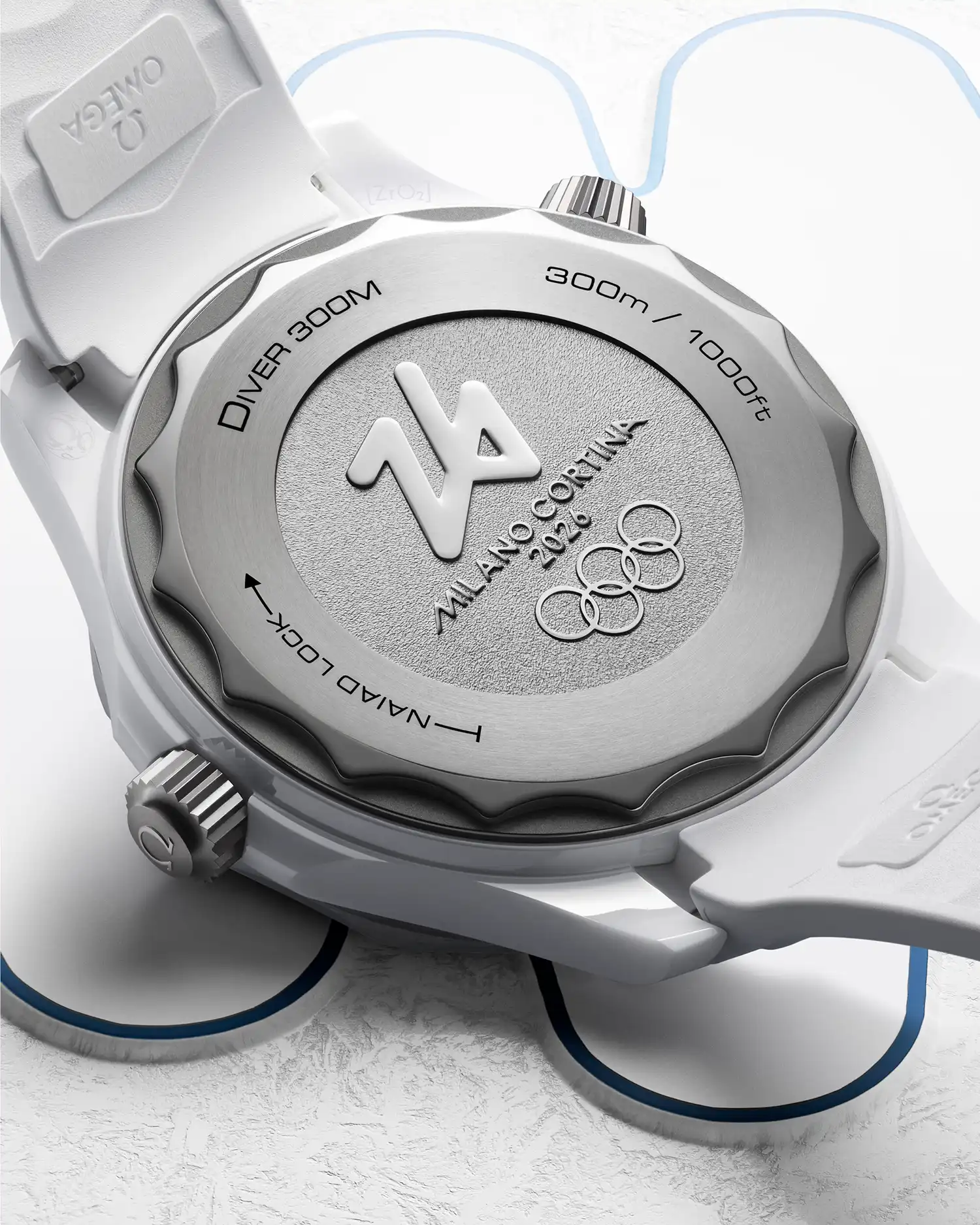 View of the titanium caseback with the stamped Milano Cortina 2026 Olympic emblem and NAIAD LOCK system.