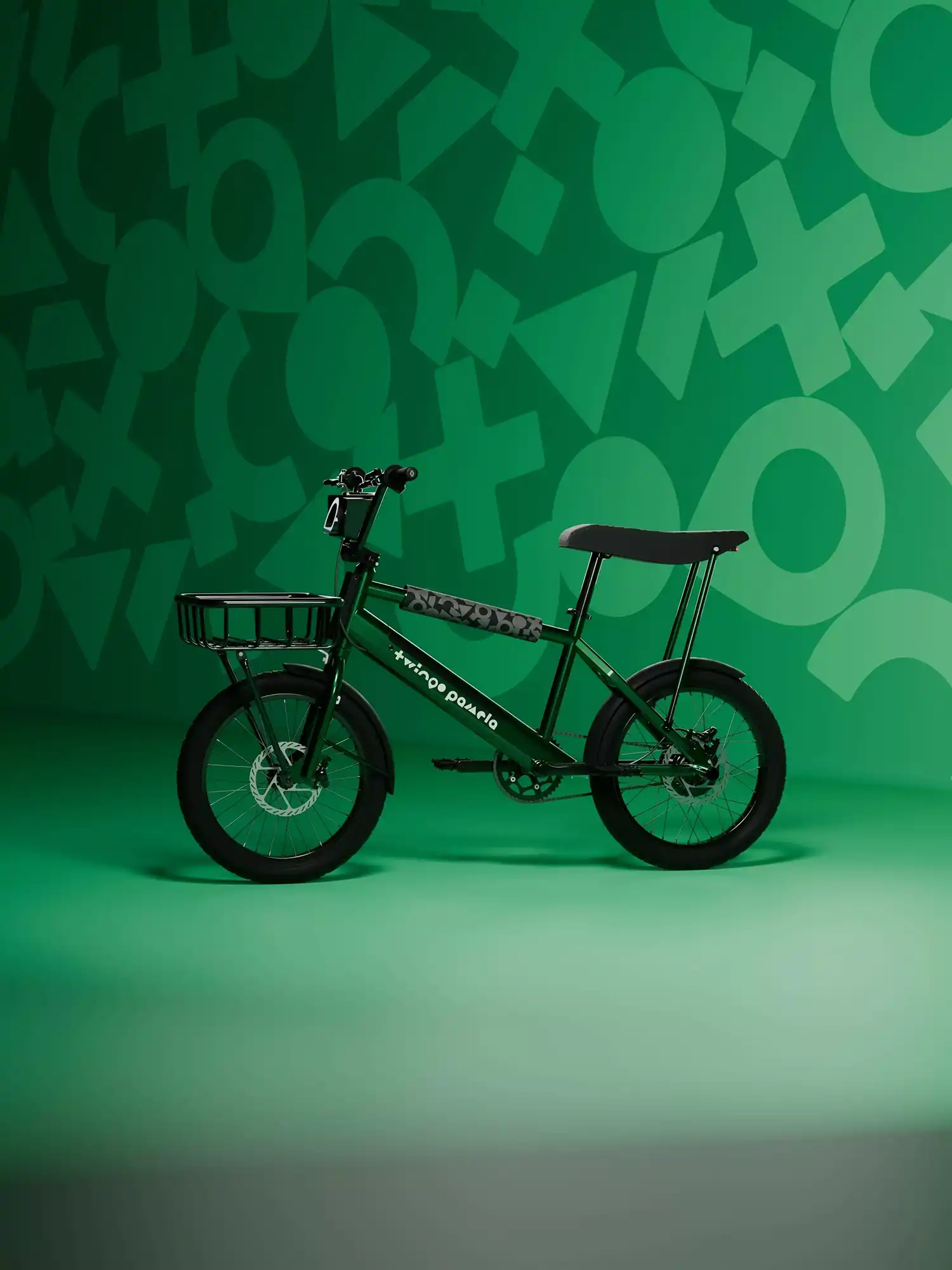 Side view of the green Pamela compact electric cargo bike with a black front basket.