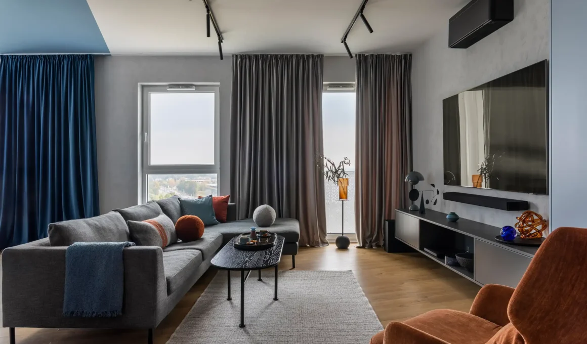 Modern luxury living room featuring an integrated black smart HVAC unit and minimalist interior design.