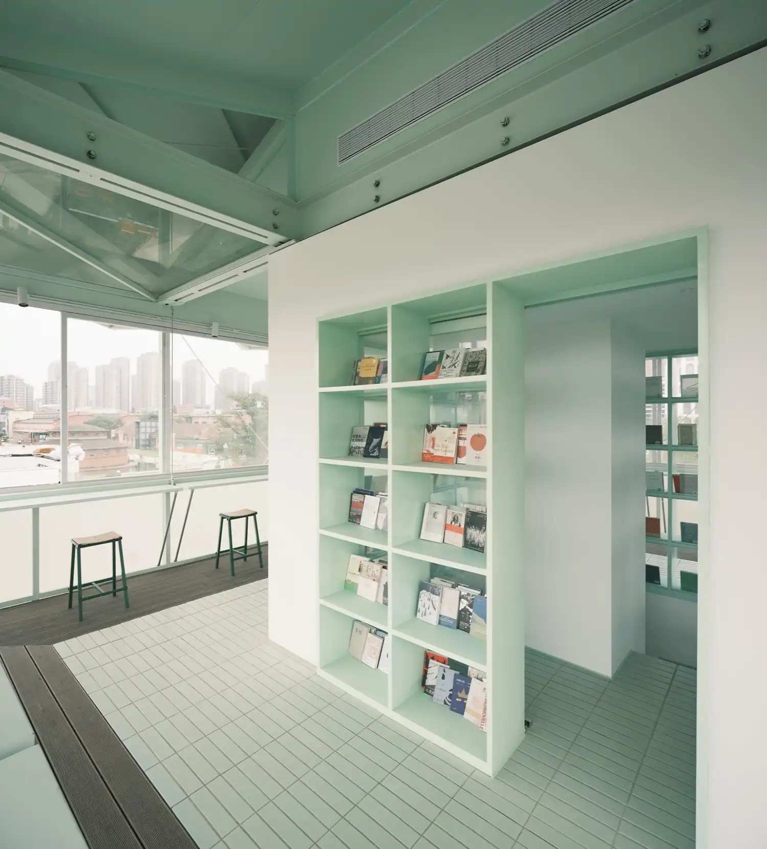Interior bookshelves and mint green tiling Hefei bookstore