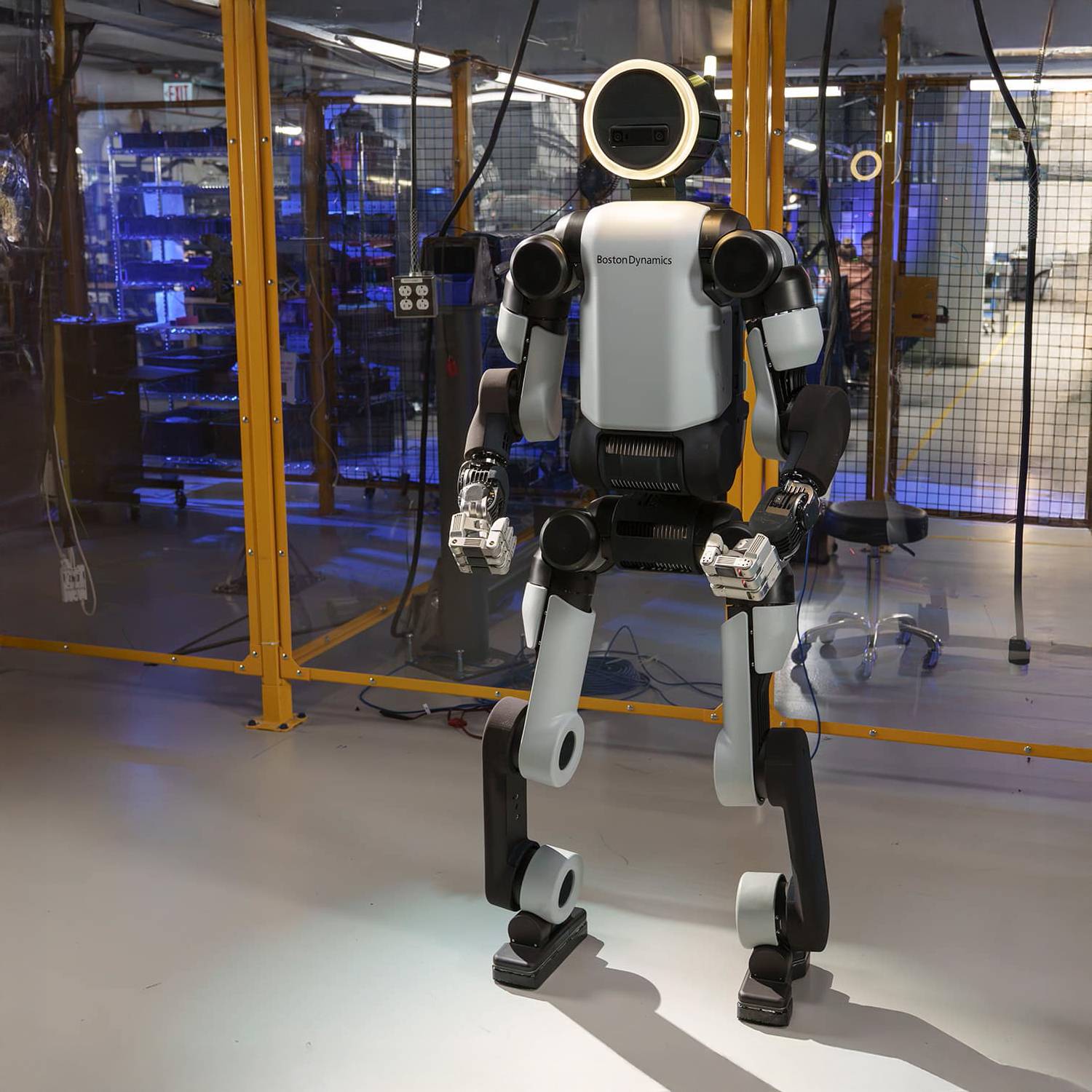 Full-body studio shot of the Boston Dynamics Atlas humanoid robot, showcasing its advanced mechanical engineering and bipedal structure.