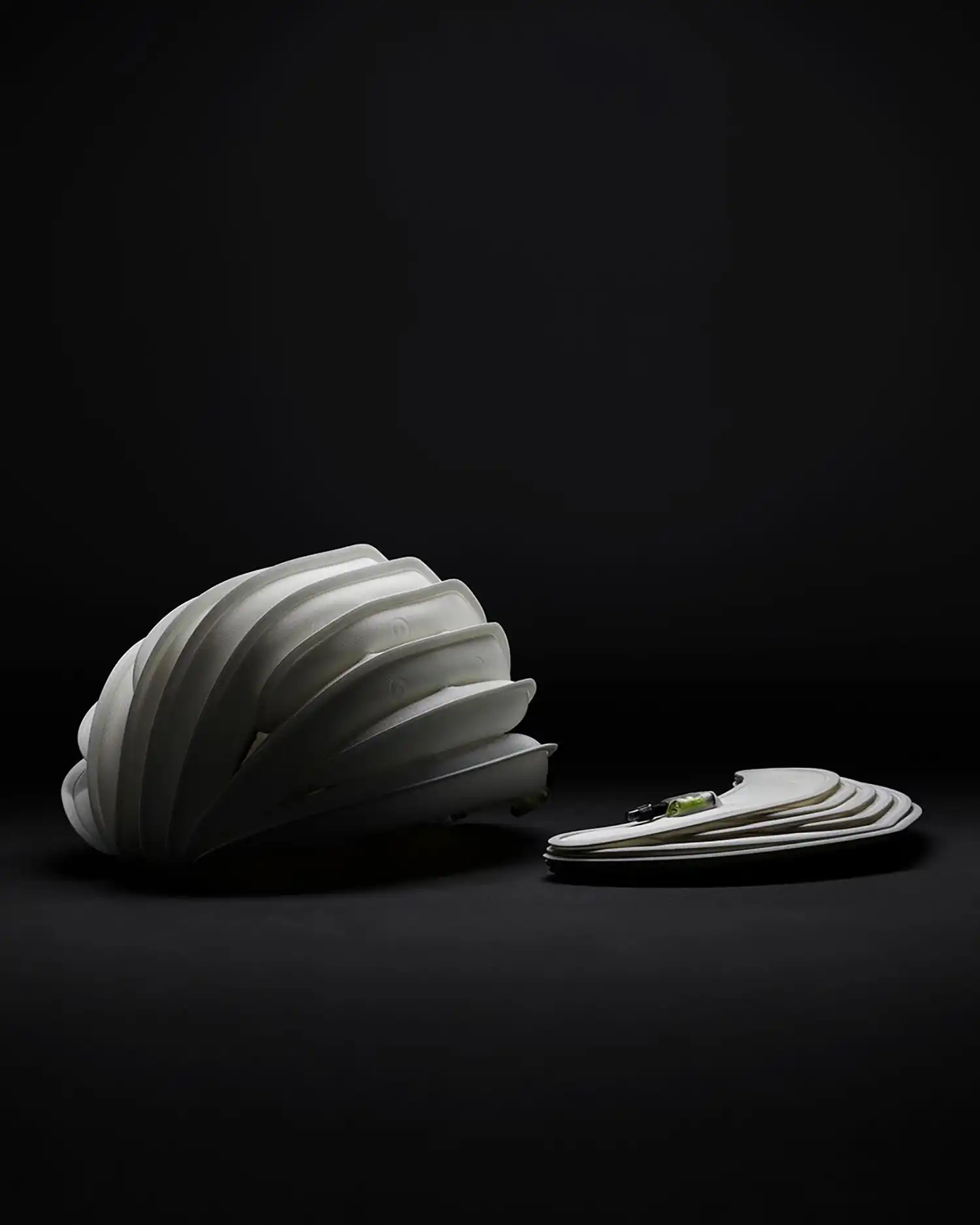 Side-by-side comparison of an inflated and a fully deflated Ventete aH-1 helmet on a dark surface.