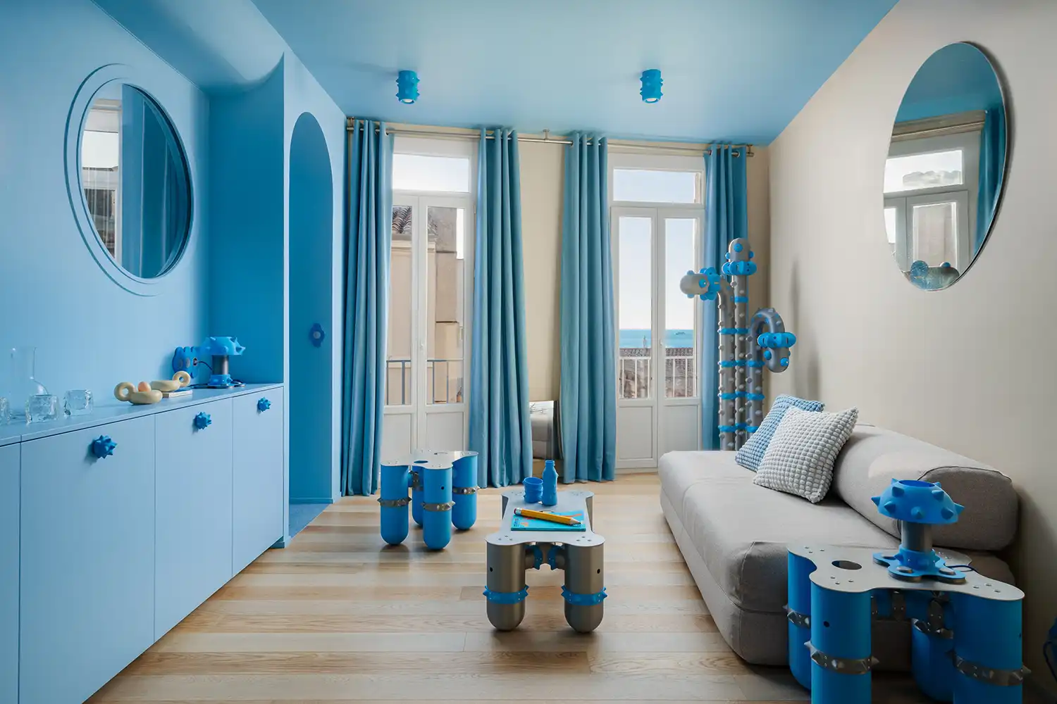 Liquid forms and "creature-like" furniture inhabit the living space overlooking the Mediterranean.